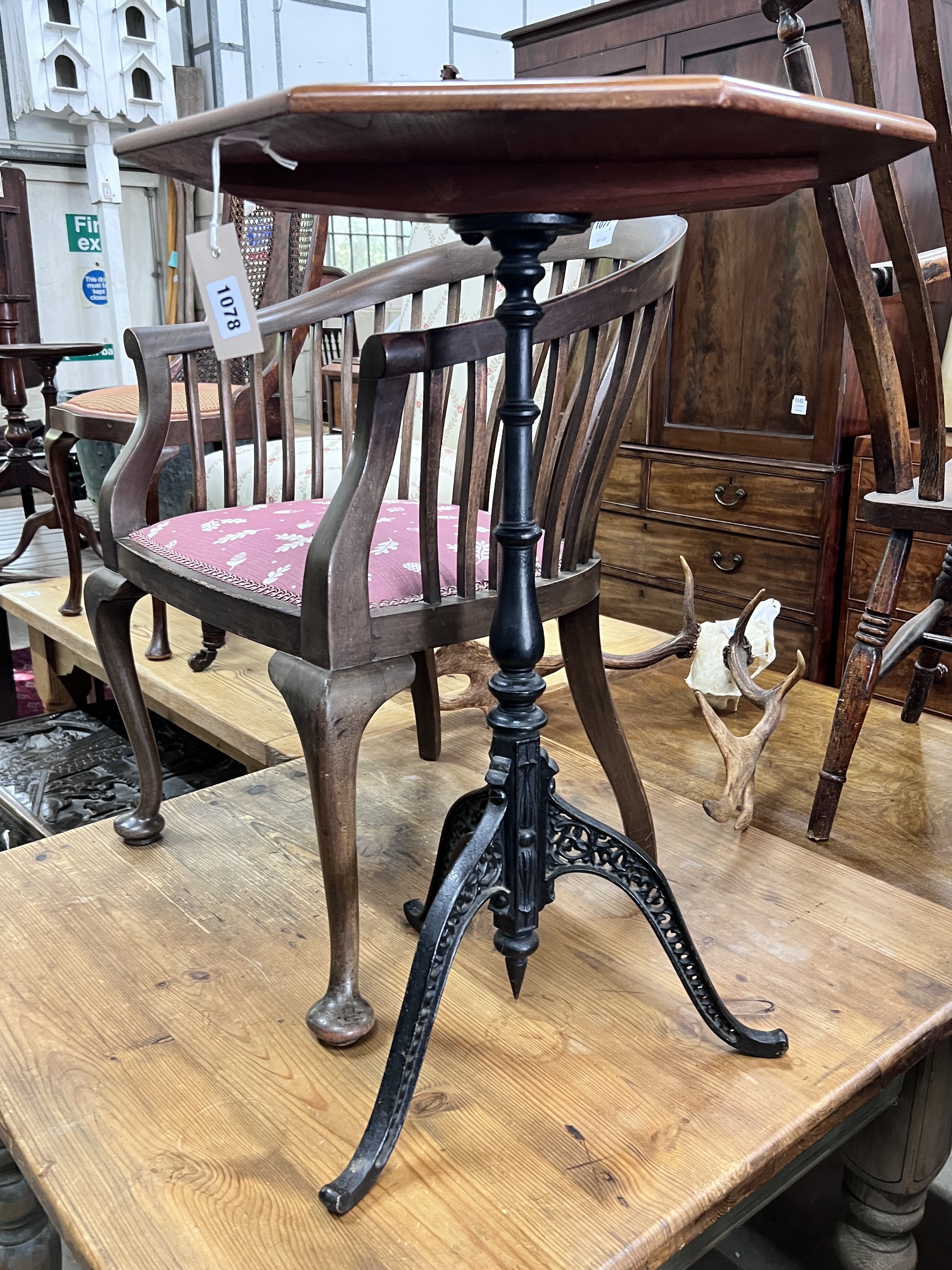 A Victorian and later mahogany and cast iron octagonal top tripod table, width 50cm, height 74cm